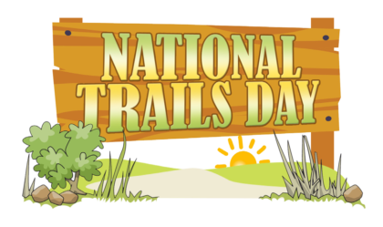 a cartoon of a wooden sign that reads National Trails Day